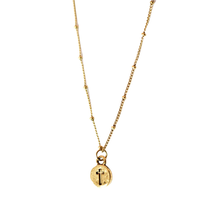 Gold cross necklace with beaded chain.